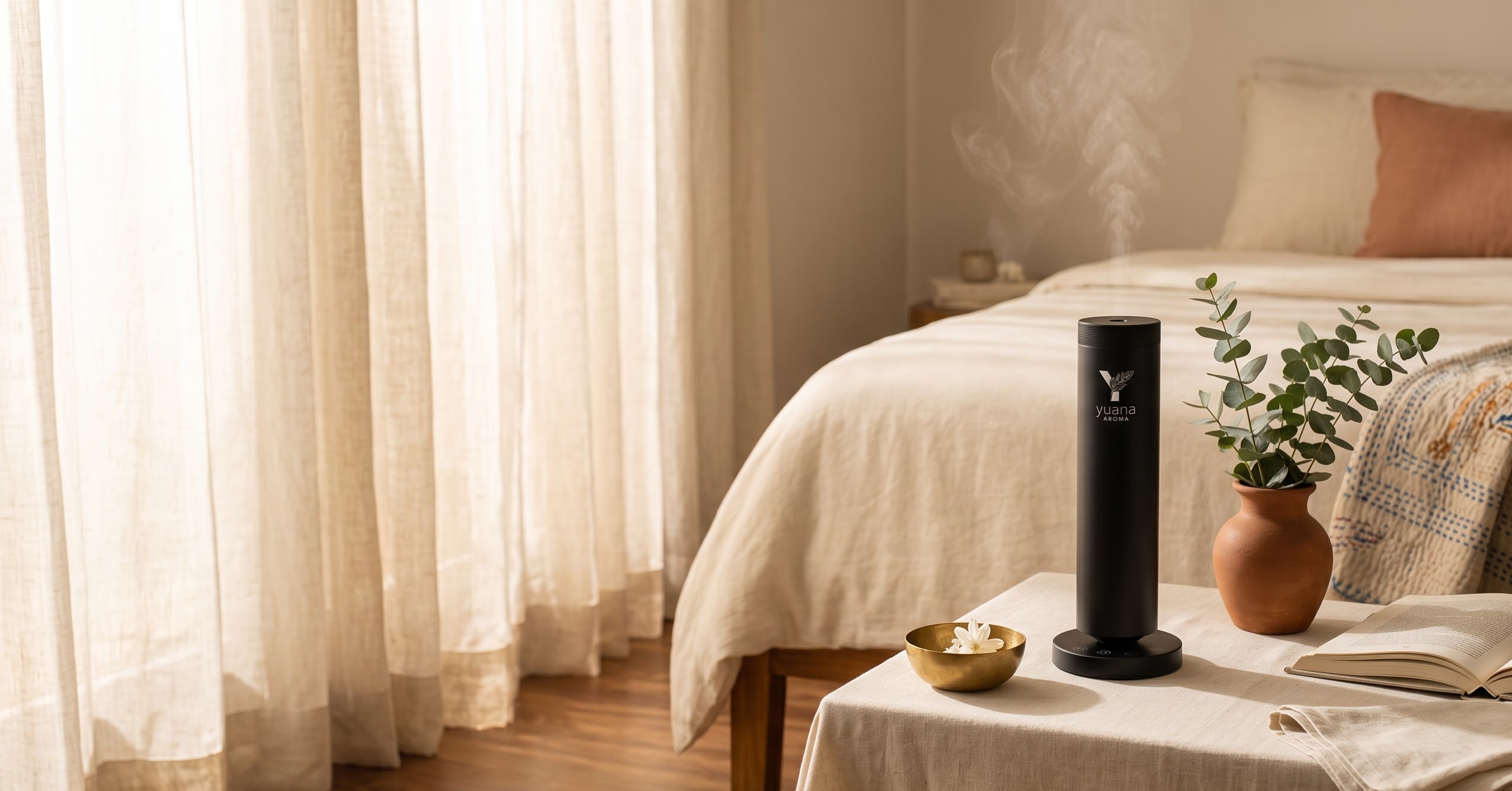 Yuana Aroma Pearl diffuser on a linen-covered bedside bench in warm morning light